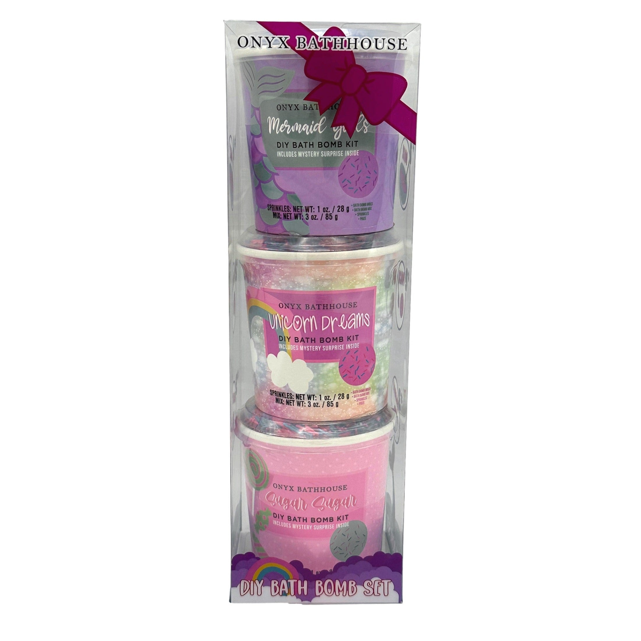 A stack of three Onyx Bathhouse DIY bath bomb kits in clear packaging, featuring Mermaid, Unicorn, and Sugar themes.